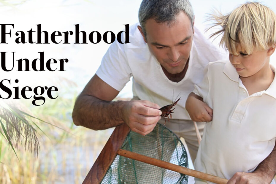 A father shows his son how to attach bait to a fishing line