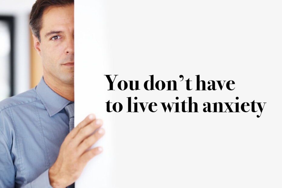 A man looks nervous as he peers around a door